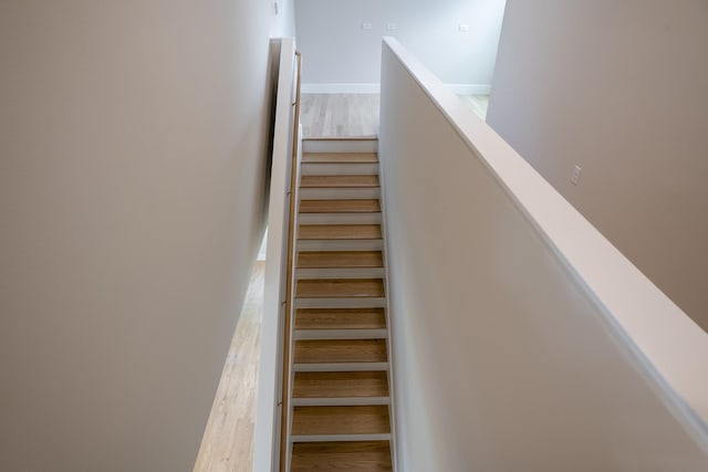 5404 Mulvey St, Houston, TX 77020 - staircase featuring wood finished floors