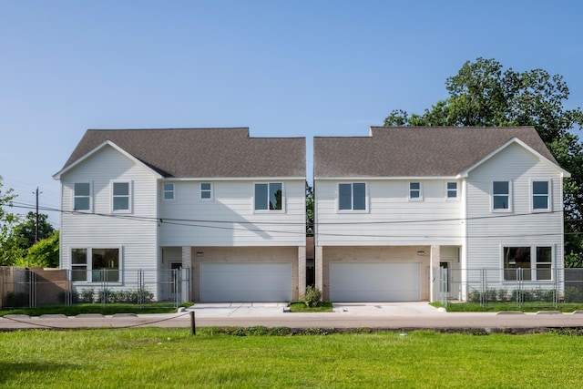 5404 Mulvey St, Houston, TX 77020 - townhome / multi-family property featuring an attached garage, driveway, and a shingled roof