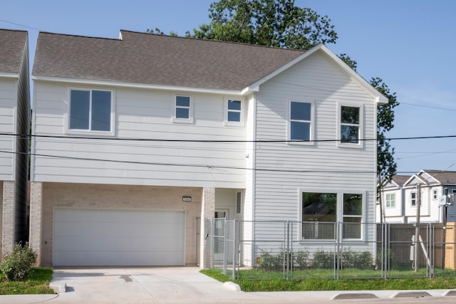 5404 Mulvey St, Houston, TX 77020 - townhome / multi-family property featuring an attached garage, driveway, and a shingled roof