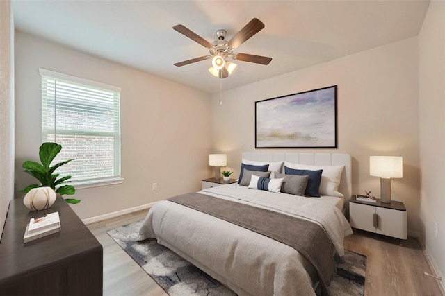 3227 Zephyr Park Ln, Katy, TX 77494 - bedroom with light wood finished floors and a ceiling fan