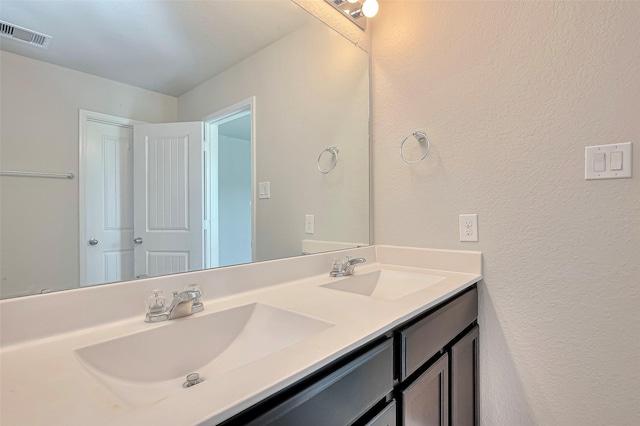 3227 Zephyr Park Ln, Katy, TX 77494 - full bathroom with double vanity and a textured wall