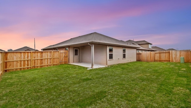 3227 Zephyr Park Ln, Katy, TX 77494 - back of house at dusk featuring a fenced backyard and a patio