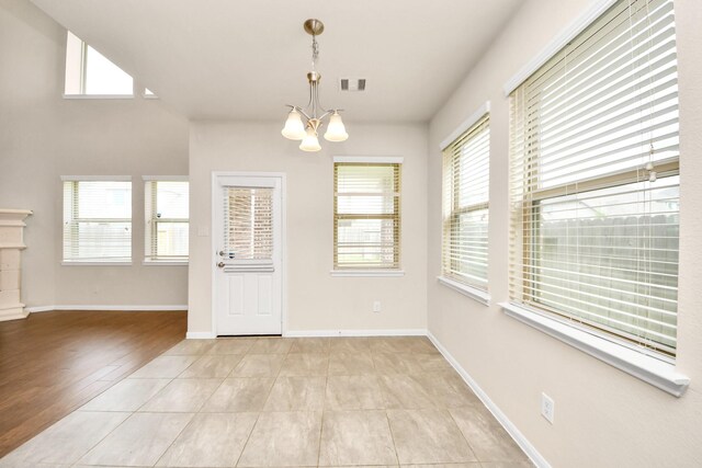 2714 Birchwood Meadow Ct, Katy, TX 77494 - unfurnished dining area featuring a chandelier and baseboards