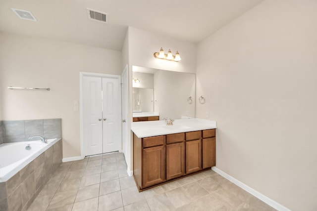 2714 Birchwood Meadow Ct, Katy, TX 77494 - bathroom with vanity, a bath, and tile patterned flooring