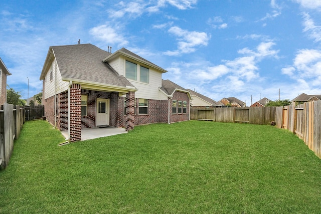 2714 Birchwood Meadow Ct, Katy, TX 77494 - rear view of house featuring brick siding, a shingled roof, a fenced backyard, and a patio