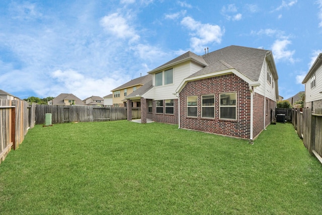 2714 Birchwood Meadow Ct, Katy, TX 77494 - back of house featuring brick siding, a fenced backyard, and a shingled roof