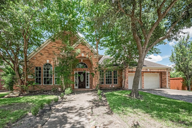 6507 Pinewood Trace Ln, Houston, TX 77041 - traditional-style home with driveway, an attached garage, and brick siding