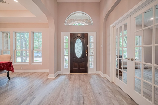 6507 Pinewood Trace Ln, Houston, TX 77041 - foyer featuring arched walkways, wood finished floors, french doors, and a high ceiling