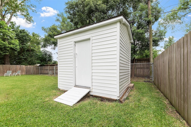 2801 John St, La Marque, TX 77568 - view of shed featuring a fenced backyard