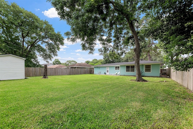 2801 John St, La Marque, TX 77568 - fenced backyard featuring a storage shed