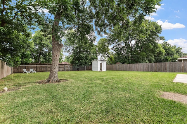 2801 John St, La Marque, TX 77568 - fenced backyard with a storage unit