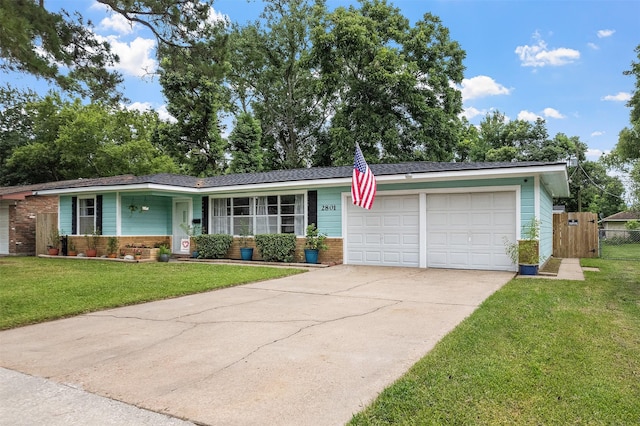 2801 John St, La Marque, TX 77568 - view of front of house featuring a garage, driveway, and brick siding