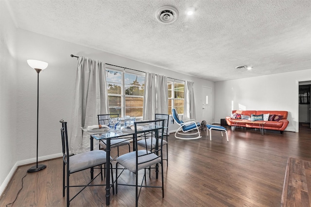 2801 John St, La Marque, TX 77568 - dining space with a textured ceiling and wood finished floors
