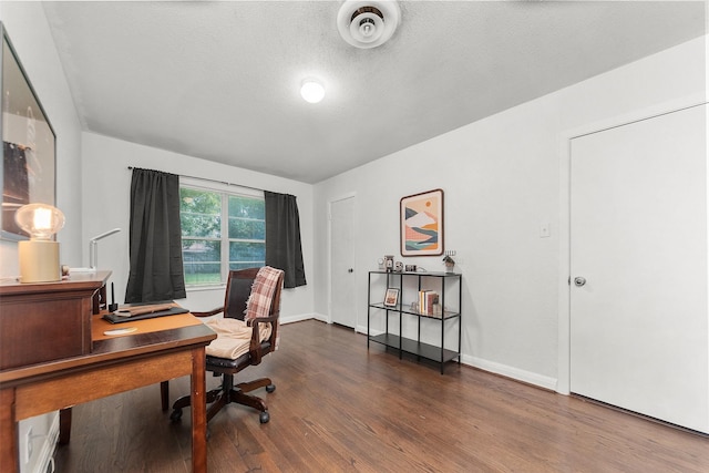 2801 John St, La Marque, TX 77568 - office area with dark wood-type flooring and a textured ceiling