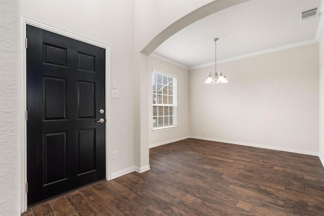 24727 Lake Basin Ct, Katy, TX 77493 - entrance foyer with arched walkways, dark wood-type flooring, a chandelier, and crown molding