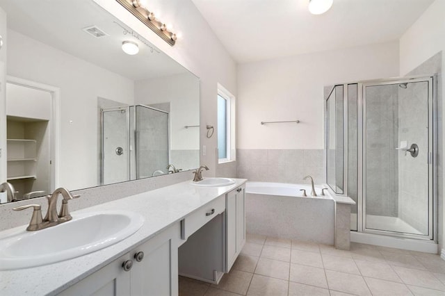 24727 Lake Basin Ct, Katy, TX 77493 - full bath featuring a bath, tile patterned flooring, a shower stall, and double vanity