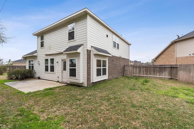 24727 Lake Basin Ct, Katy, TX 77493 - rear view of house with a patio area, a fenced backyard, and brick siding