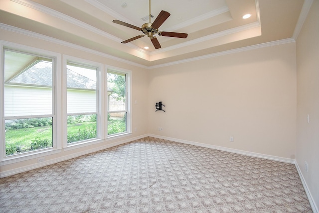 3003 Bernadette Ln, Houston, TX 77043 - carpeted spare room featuring a tray ceiling, a ceiling fan, and ornamental molding