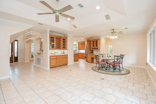 3003 Bernadette Ln, Houston, TX 77043 - dining space featuring a ceiling fan, arched walkways, recessed lighting, light tile patterned floors, and a raised ceiling