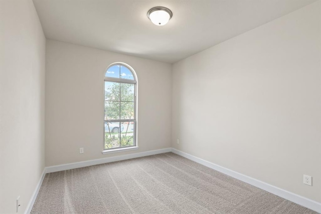 18511 Wolf Mountain Ln, Cypress, TX 77433 - carpeted spare room featuring baseboards