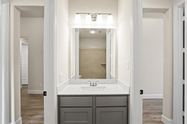 18511 Wolf Mountain Ln, Cypress, TX 77433 - bathroom with vanity and wood finished floors