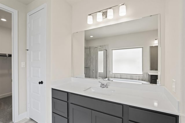 18511 Wolf Mountain Ln, Cypress, TX 77433 - full bathroom featuring a shower stall, vanity, a garden tub, a walk in closet, and recessed lighting