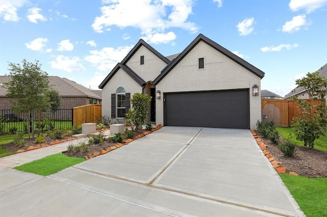 18511 Wolf Mountain Ln, Cypress, TX 77433 - view of front facade with driveway, brick siding, and a garage