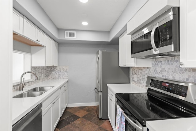 8101 Amelia Rd Unit 509, Houston, TX 77055 - kitchen with stainless steel appliances, light countertops, white cabinets, and recessed lighting