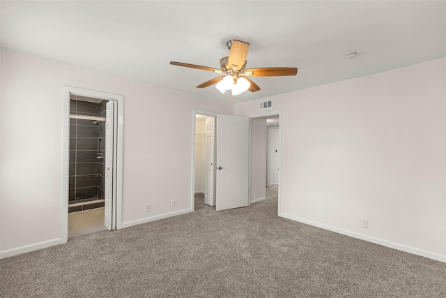 8101 Amelia Rd Unit 509, Houston, TX 77055 - unfurnished bedroom with a spacious closet, carpet flooring, a closet, ceiling fan, and connected bathroom