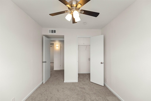 8101 Amelia Rd Unit 509, Houston, TX 77055 - unfurnished bedroom with light carpet, a closet, ceiling fan, and a walk in closet