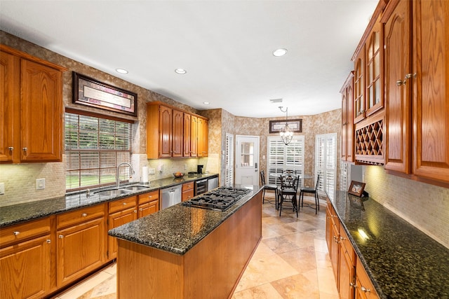 8511 Parmer Ct, Houston, TX 77064 - kitchen featuring gas cooktop, plenty of natural light, recessed lighting, brown cabinets, and a kitchen island