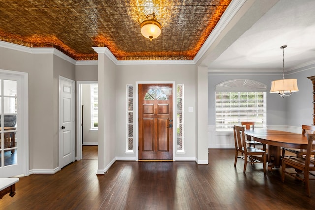 8511 Parmer Ct, Houston, TX 77064 - foyer entrance featuring dark wood-type flooring, healthy amount of natural light, ornamental molding, and a chandelier