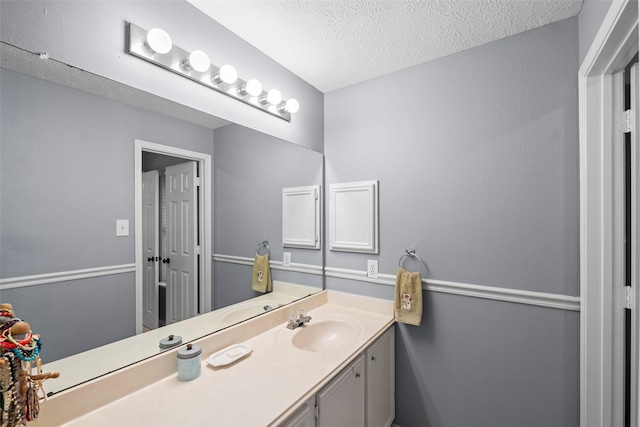 8511 Parmer Ct, Houston, TX 77064 - bathroom with a textured ceiling and vanity