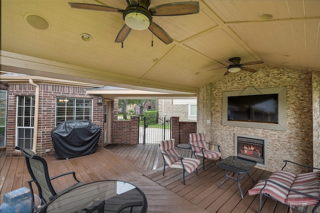 8511 Parmer Ct, Houston, TX 77064 - wooden deck featuring an outdoor stone fireplace, a grill, and ceiling fan