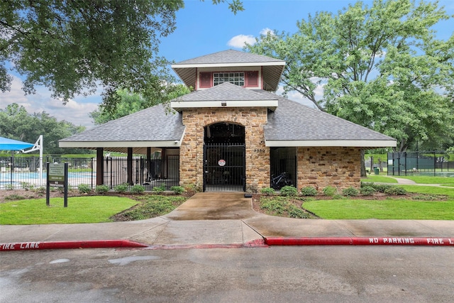 8511 Parmer Ct, Houston, TX 77064 - view of front facade with a shingled roof and stone siding