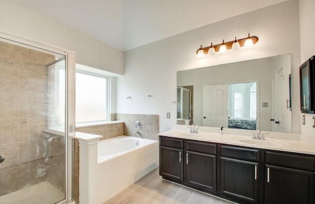17603 Memorial Falls Dr, Tomball, TX 77375 - full bath with a shower stall, wood finished floors, a bath, and double vanity