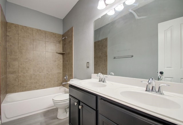 17603 Memorial Falls Dr, Tomball, TX 77375 - full bathroom featuring double vanity, shower / tub combination, and wood finished floors