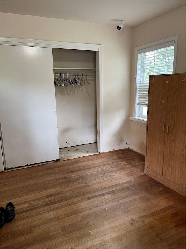 7403 N Dearborn St, Houston, TX 77055 - unfurnished bedroom with a closet and wood finished floors