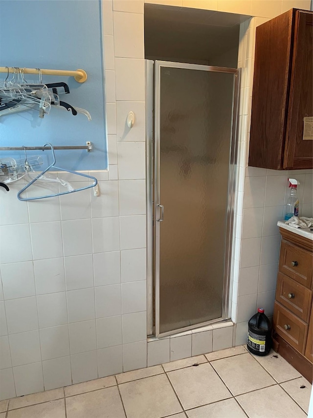 7403 N Dearborn St, Houston, TX 77055 - full bathroom with tile walls, a shower stall, tile patterned floors, and vanity