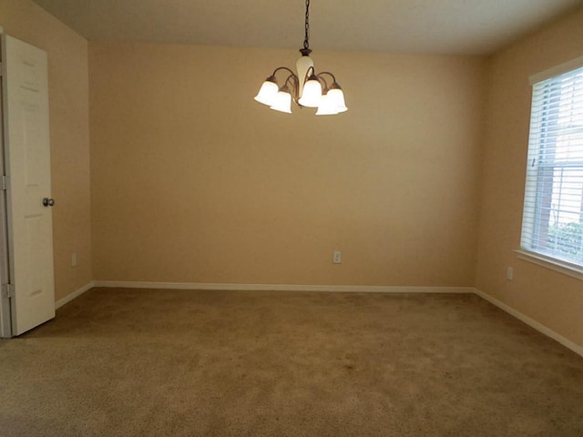 22303 Bridgestone Ridge Dr, Spring, TX 77388 - empty room featuring a chandelier, light carpet, and healthy amount of natural light