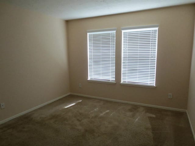 22303 Bridgestone Ridge Dr, Spring, TX 77388 - spare room with carpet floors and baseboards