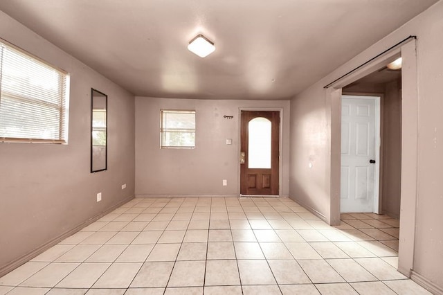 6821 Haight St, Houston, TX 77028 - foyer with light tile patterned floors