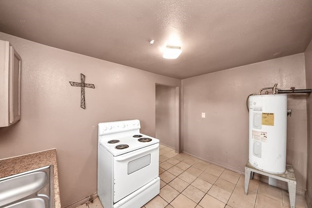 6821 Haight St, Houston, TX 77028 - kitchen with white electric range, electric water heater, and light tile patterned flooring