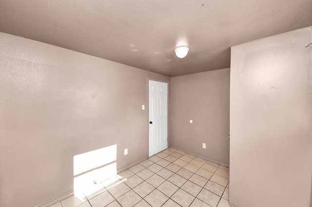 6821 Haight St, Houston, TX 77028 - empty room with light tile patterned floors and baseboards
