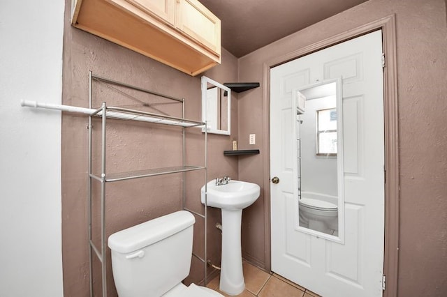 6821 Haight St, Houston, TX 77028 - bathroom with toilet and tile patterned flooring
