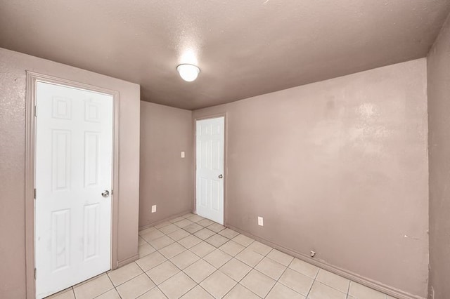 6821 Haight St, Houston, TX 77028 - unfurnished room featuring light tile patterned floors and baseboards