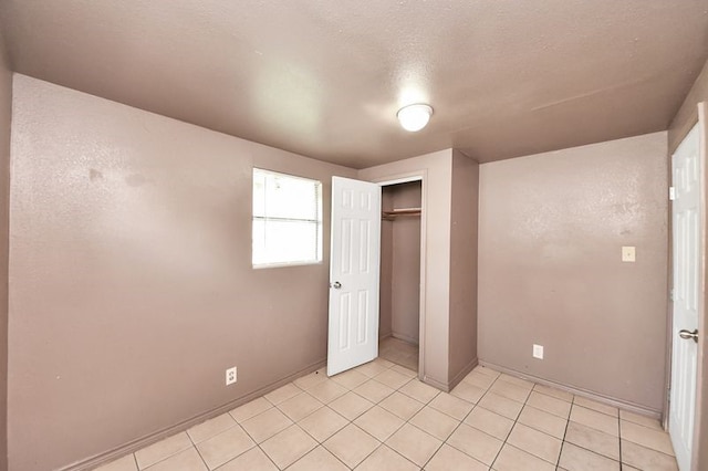 6821 Haight St, Houston, TX 77028 - unfurnished bedroom featuring a closet and light tile patterned floors