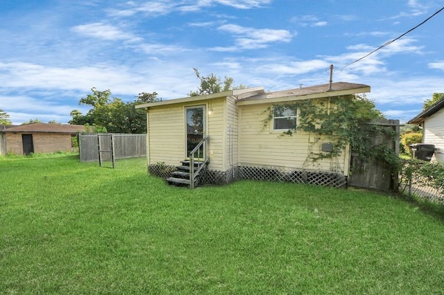 6821 Haight St, Houston, TX 77028 - rear view of house featuring entry steps