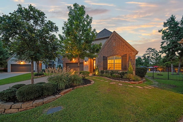 30 Madrone Terrace Pl, Tomball, TX 77375 - view of front facade with brick siding, driveway, and a garage