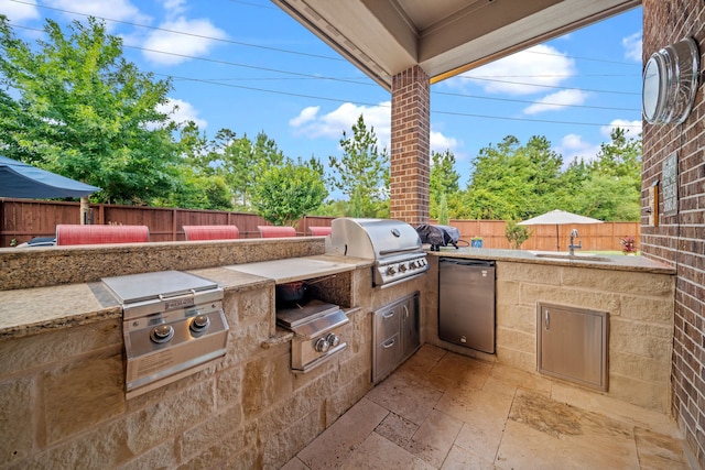 30 Madrone Terrace Pl, Tomball, TX 77375 - fenced backyard featuring area for grilling and a patio